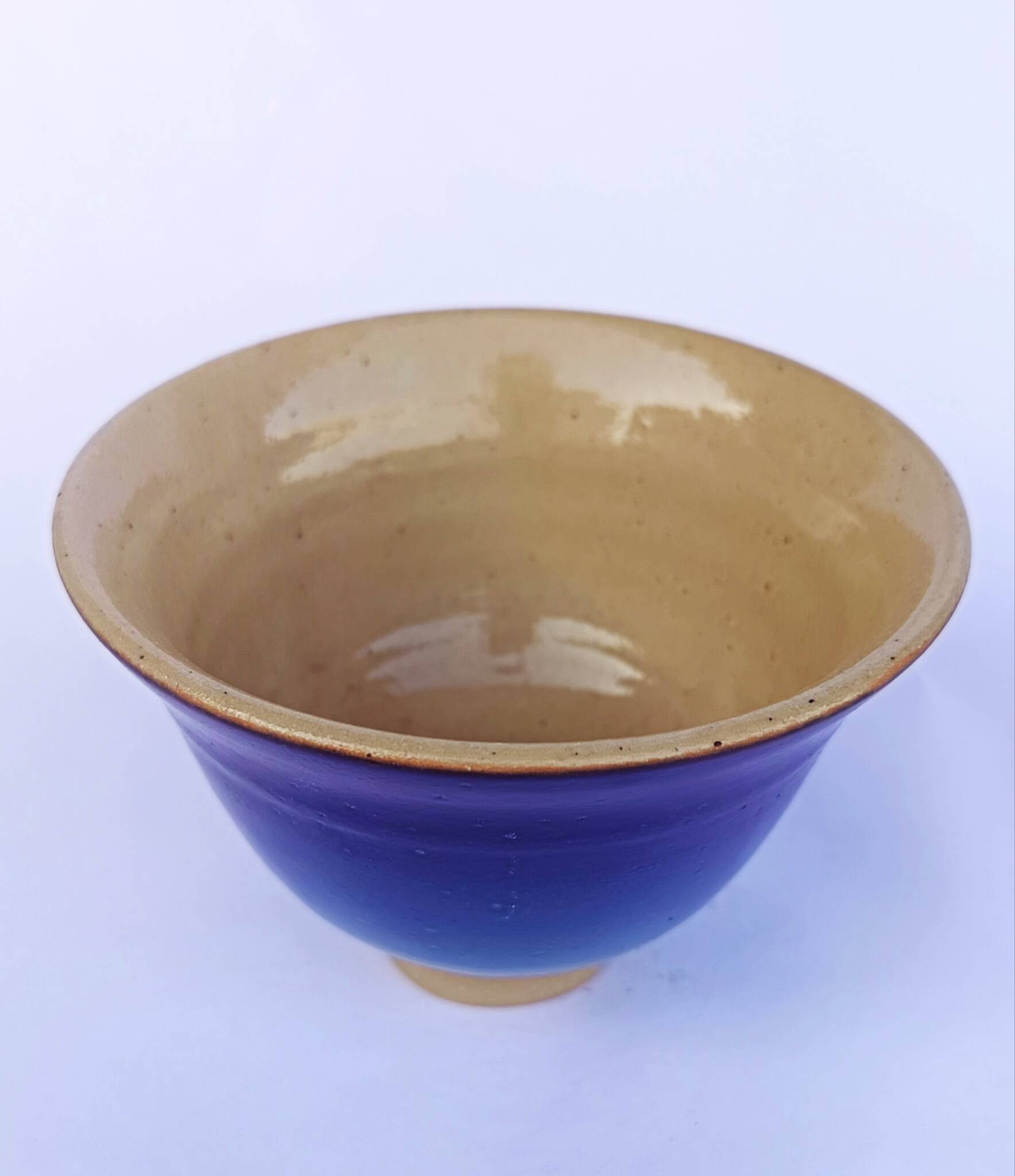 Blue glazed stoneware bowl on a foot, signed SP, Puisaye.