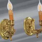 Pair of gilt bronze wall sconces in the Directoire style by Lucien Gau.