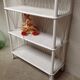 White lacquered rattan bookcase