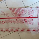 Large white tablecloth and red handmade embroidery. Lace surround;