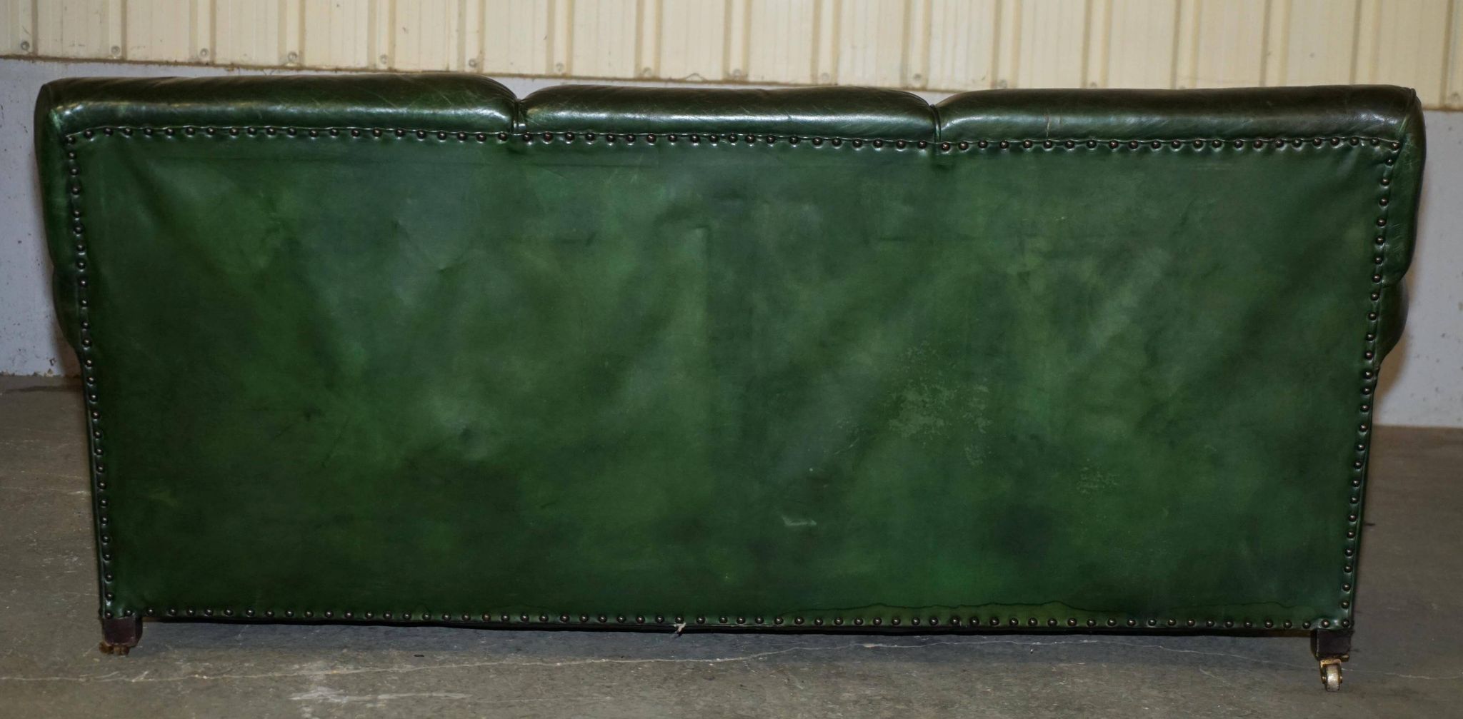 Victorian leather canapé, shield armrests, stamped Maple & Co.