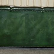 Victorian leather canapé, shield armrests, stamped Maple & Co.