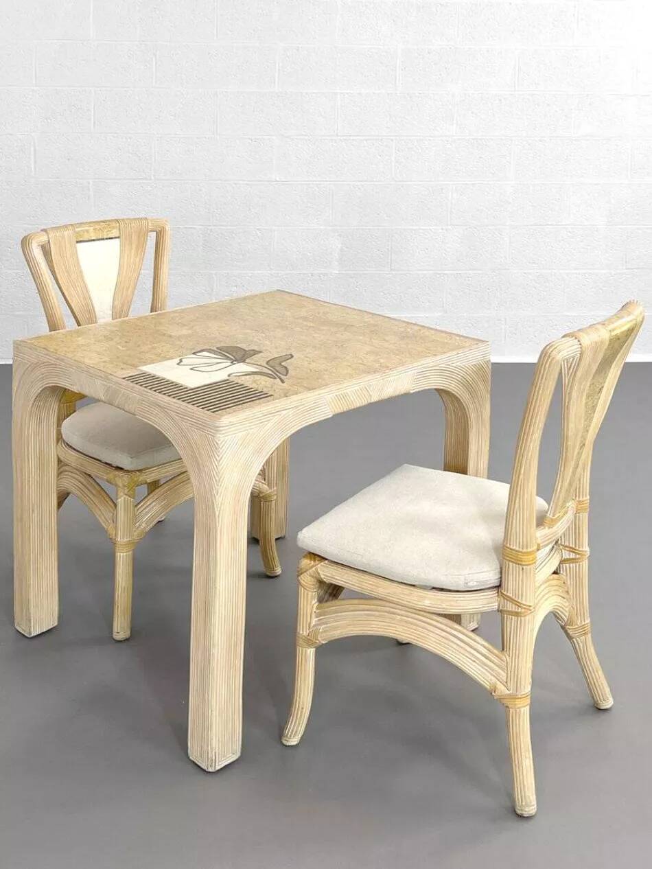 1970s rattan table with stone marquetry and matching chairs.