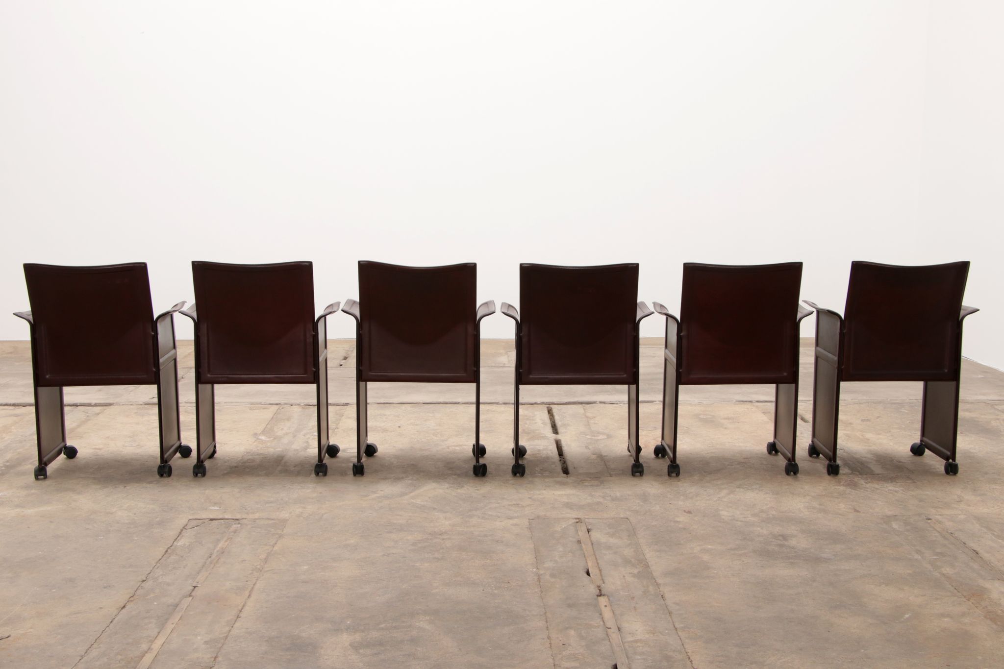 Tito Agnoli for Matteo Grassi leather dining table and six chairs