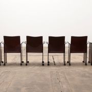 Tito Agnoli for Matteo Grassi leather dining table and six chairs