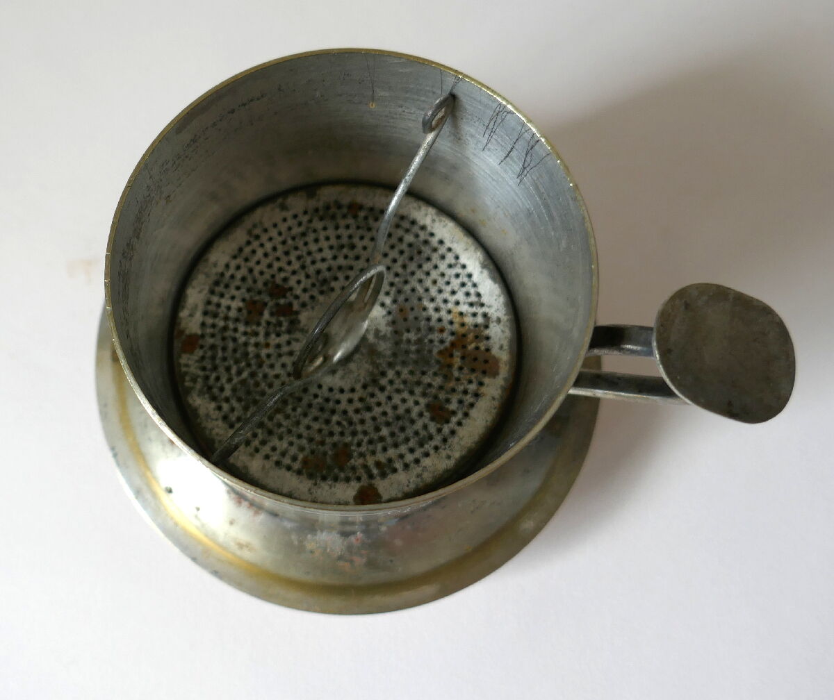 Individual silver metal coffee maker