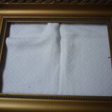 Gilded wood and stucco frame