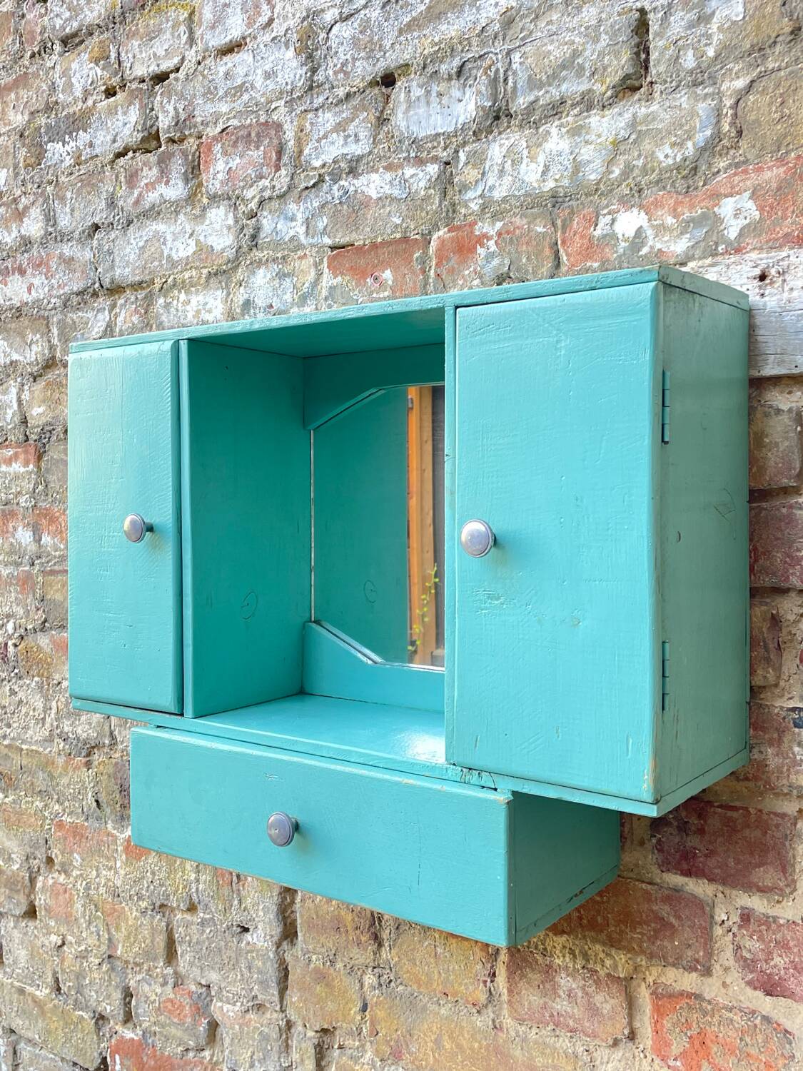 Old wall-mounted bathroom cabinet