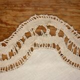 Round embroidered and crocheted doily