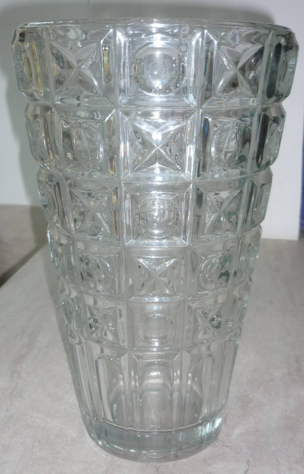 Transparent glass vase with art deco geometric patterns
