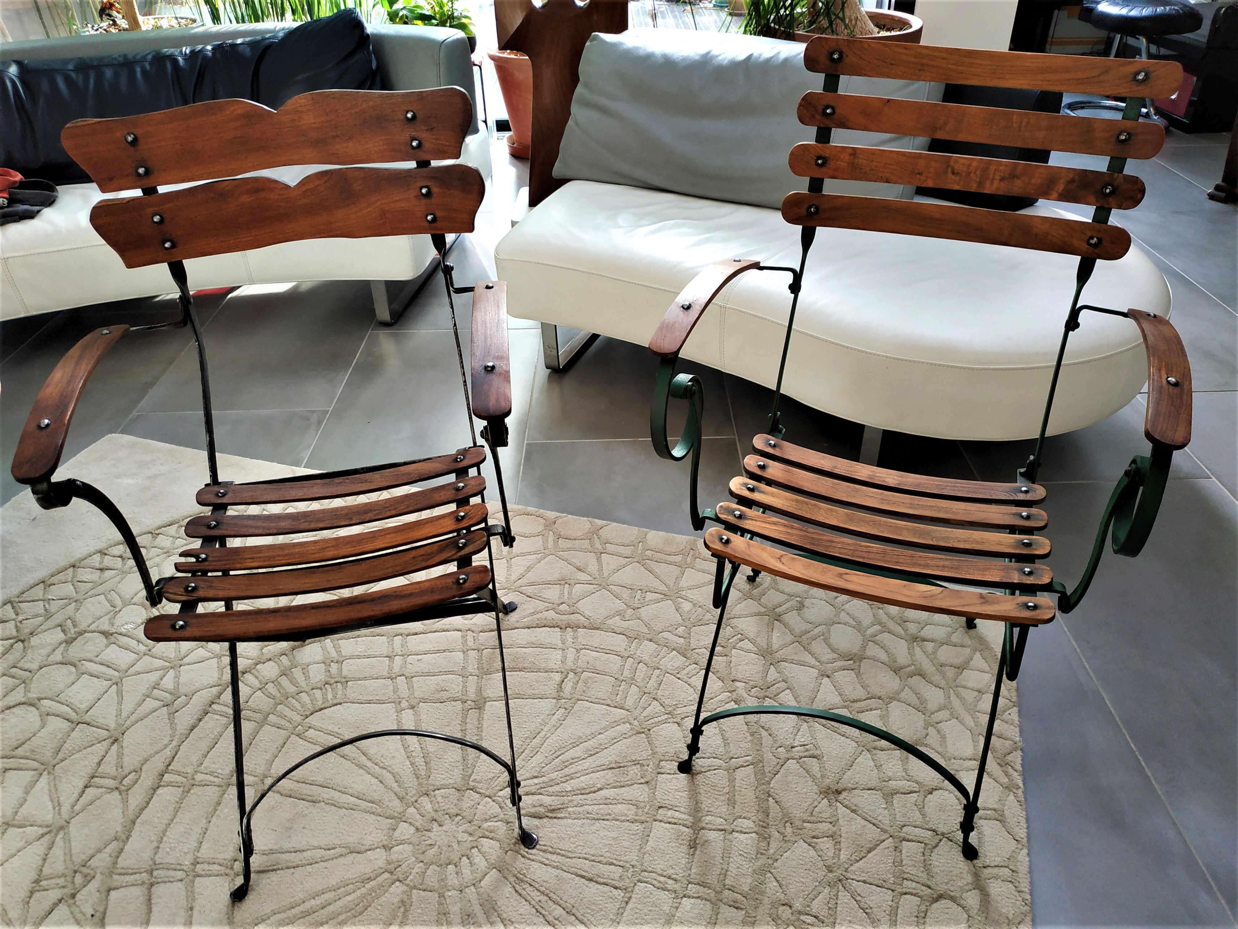 Folding garden chair with teak slats on a wrought iron structure