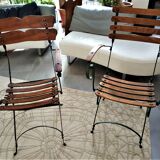 Folding garden chair with teak slats on a wrought iron structure