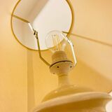 1980s ceramic table lamp with a wooden base and adjustable shade.