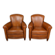 Paire de fauteuils club en cuir