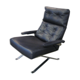 Grained leather armchair with rocking movement