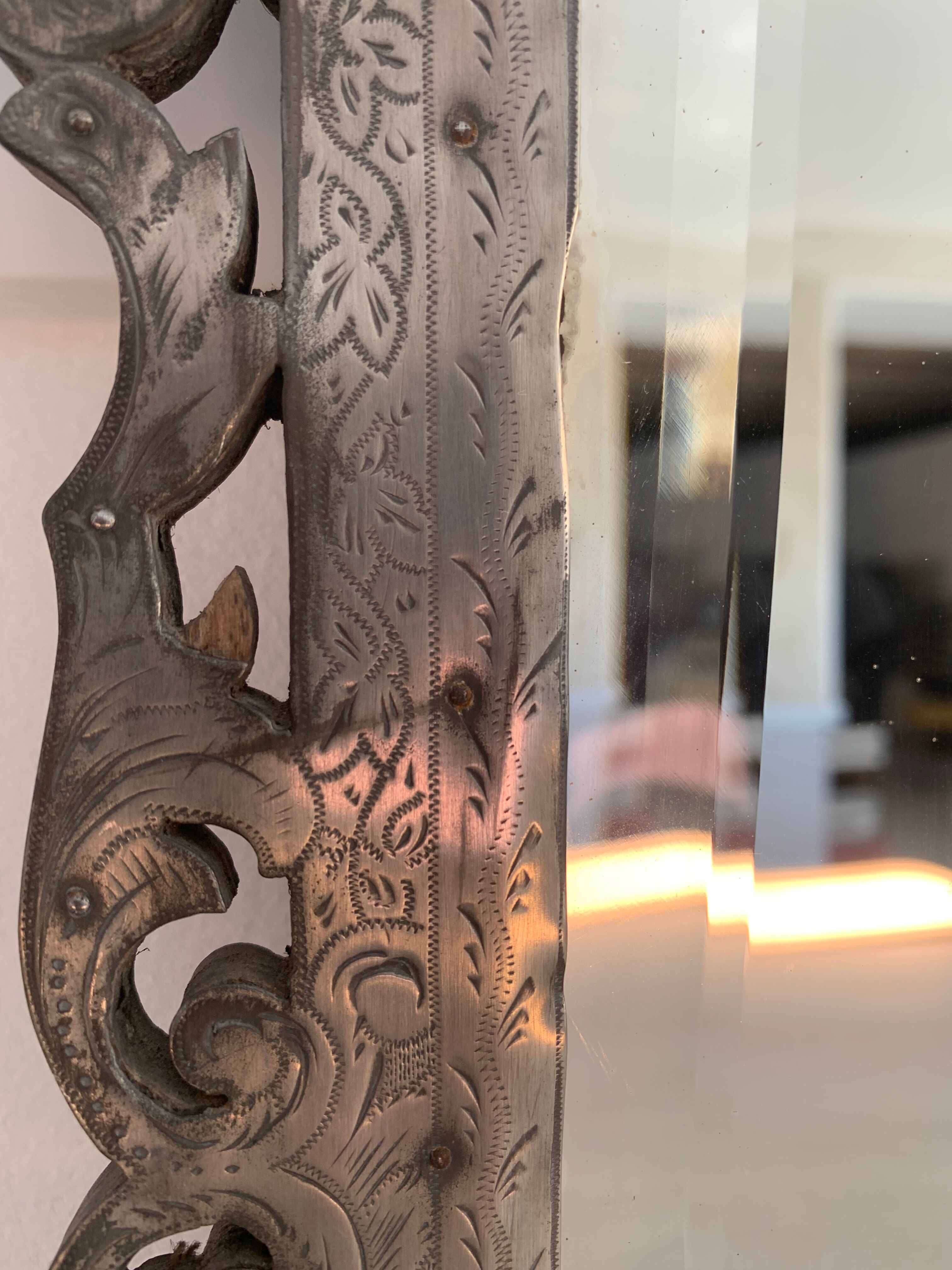 Eventful beveled mirror and openwork period 1900 repelled tin decoration