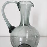 Engraved glass pitcher