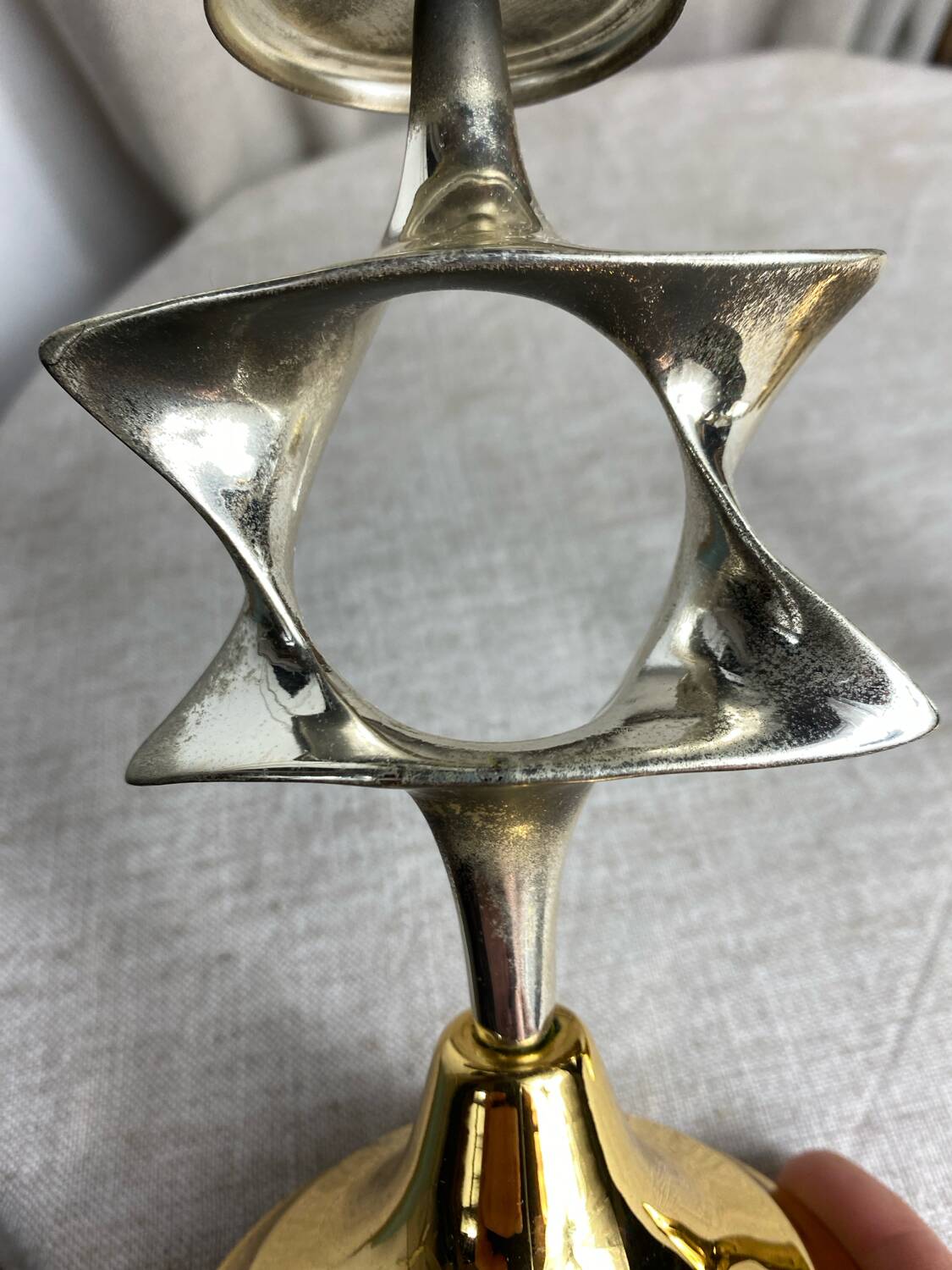 Pair of silver and gold metal candlesticks
