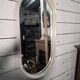 Oval mirror in white lacquer from the 1970s.
