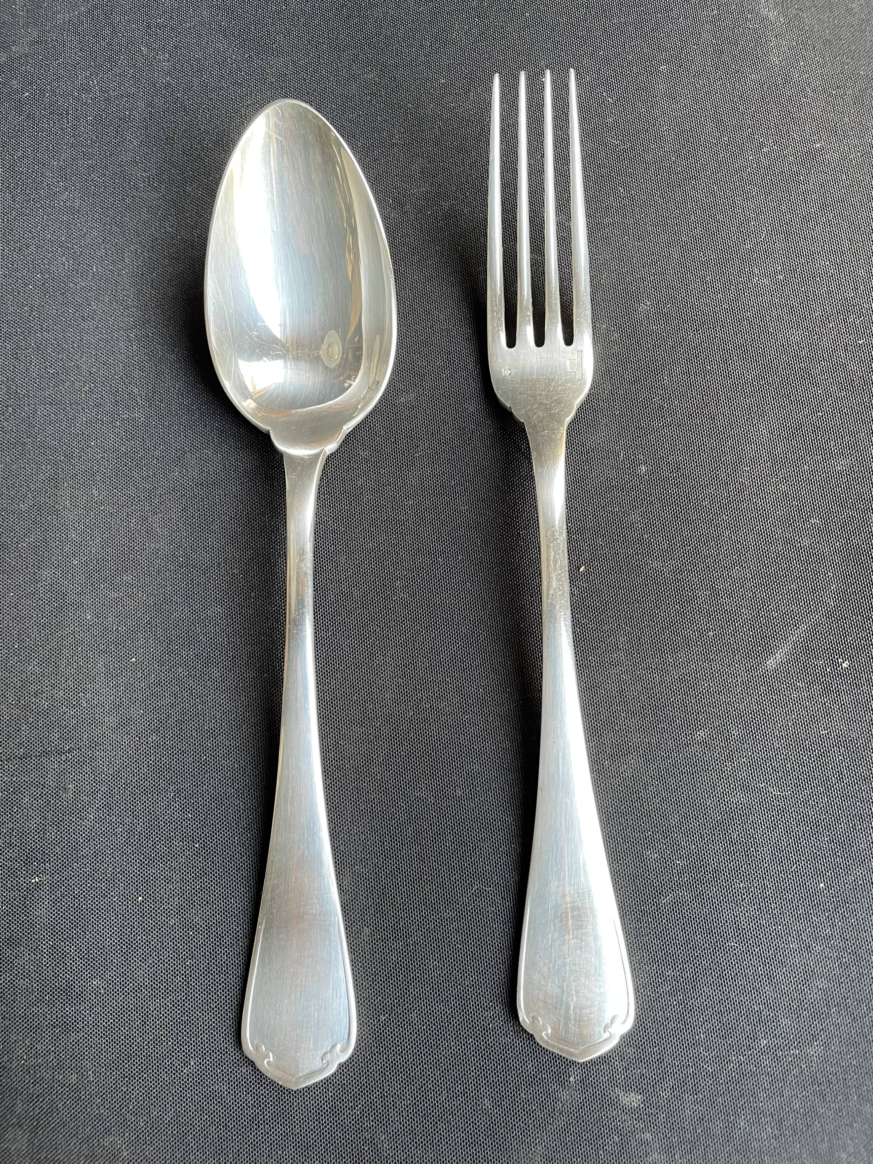 12 Christofle table forks and 12 spoons