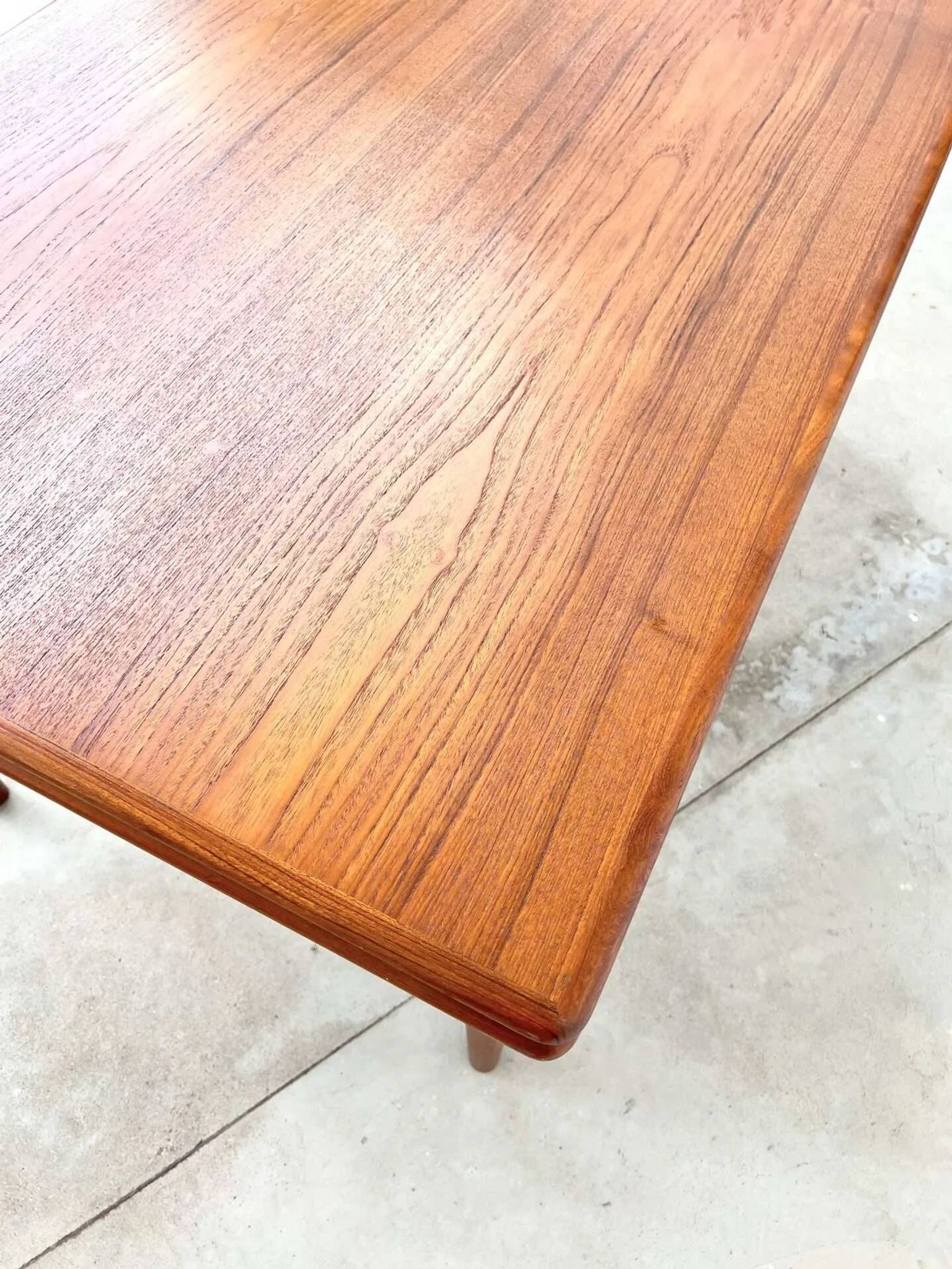Teak dining table with integrated extensions — Scandinavian