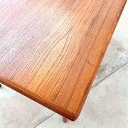 Teak dining table with integrated extensions — Scandinavian
