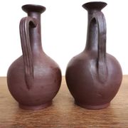 pair of terracotta bottles or carafes