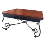 Coffee table in cherry wood with a wrought iron base.