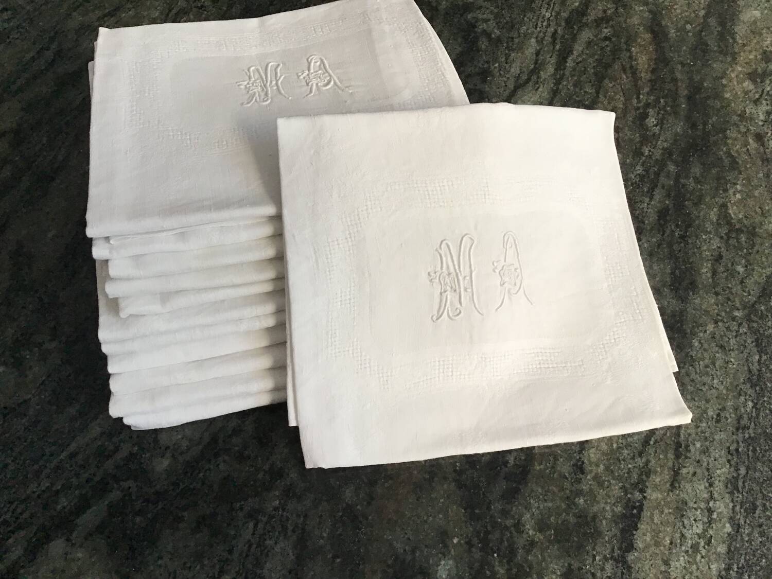 Damask napkins embroidered with an MA monogram