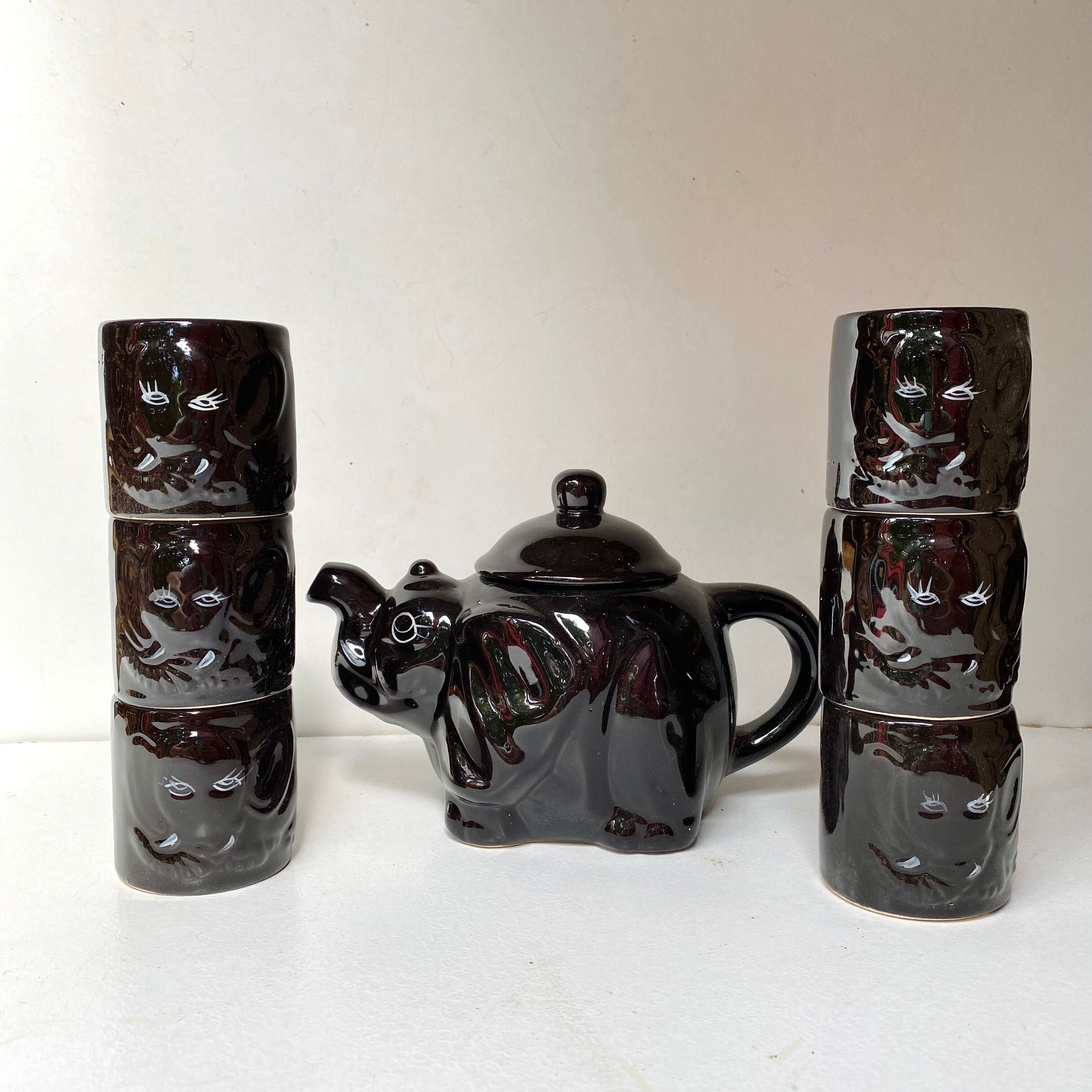Vintage teapot and vintage elephant cups