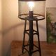 Industrial lamp in black metal to pose.