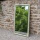 Large antique bevelled mirror in carved solid wood, green lizard – 129 × 75