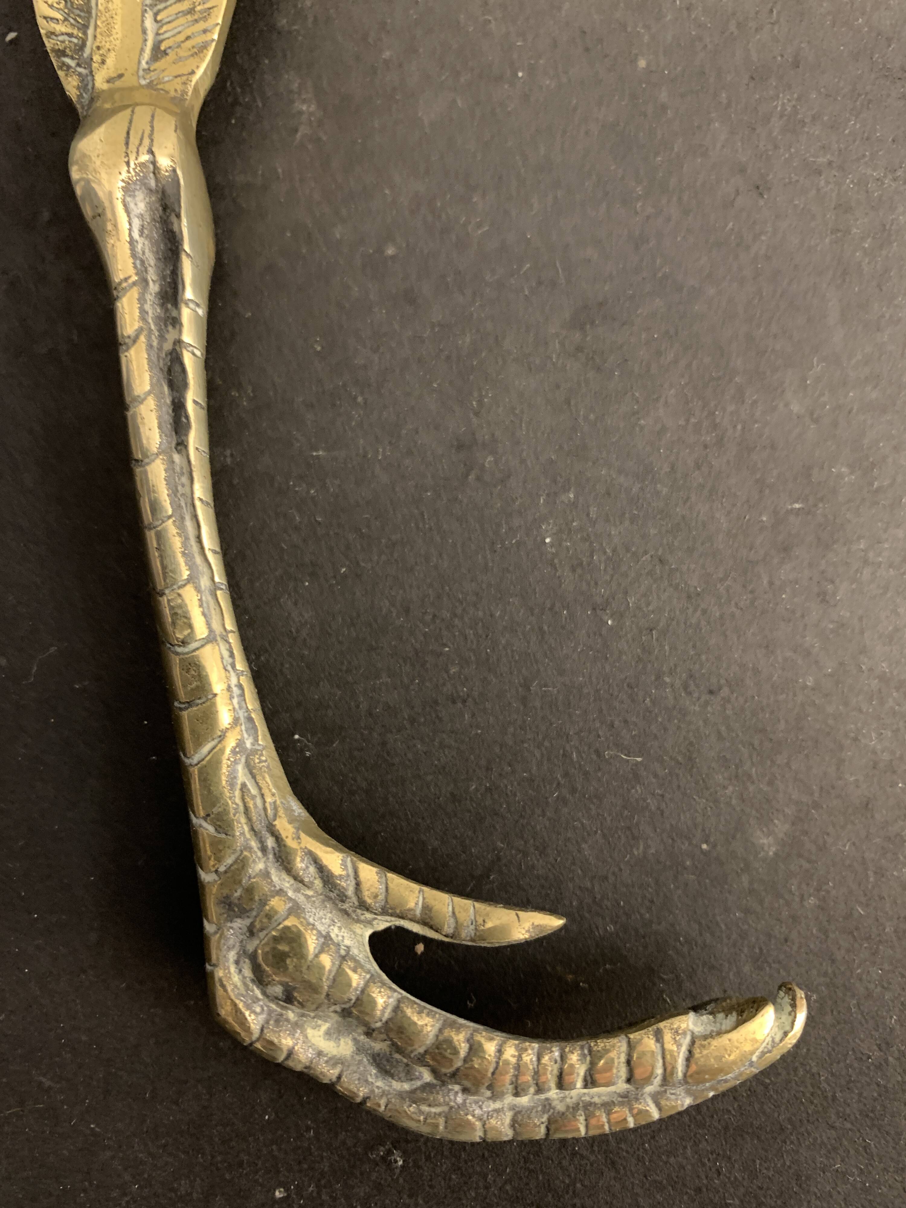 Paper cup or old bronze letter opener, eagle claw shape