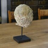 Sculpture of a head in reconstituted stone carved in the antique style of the 19th century