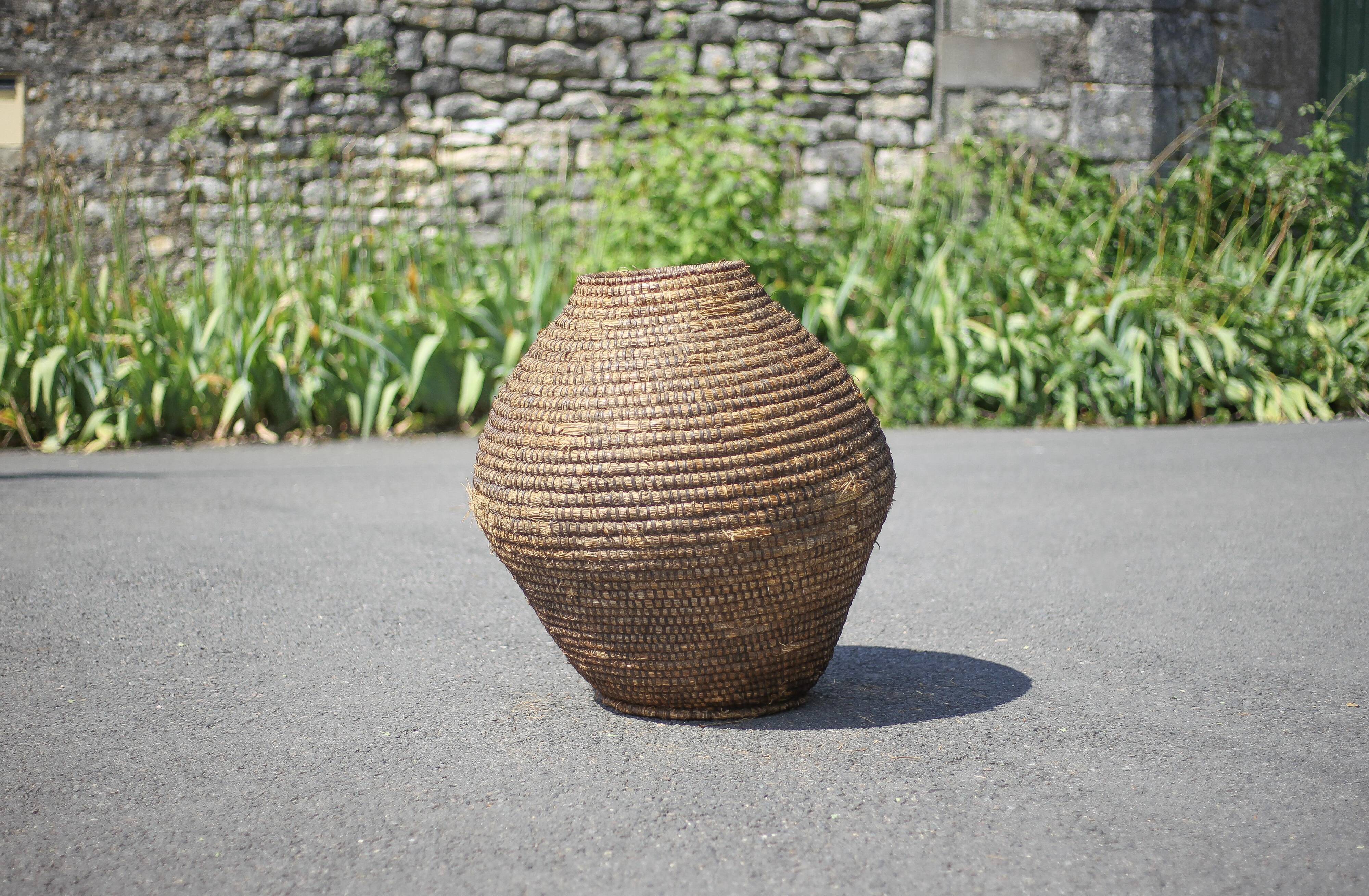 Large old basket, burgundy straw and bramble, woven basket