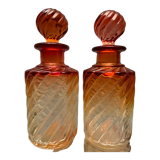 Pair of Baccarat twisted tinted crystal bottles