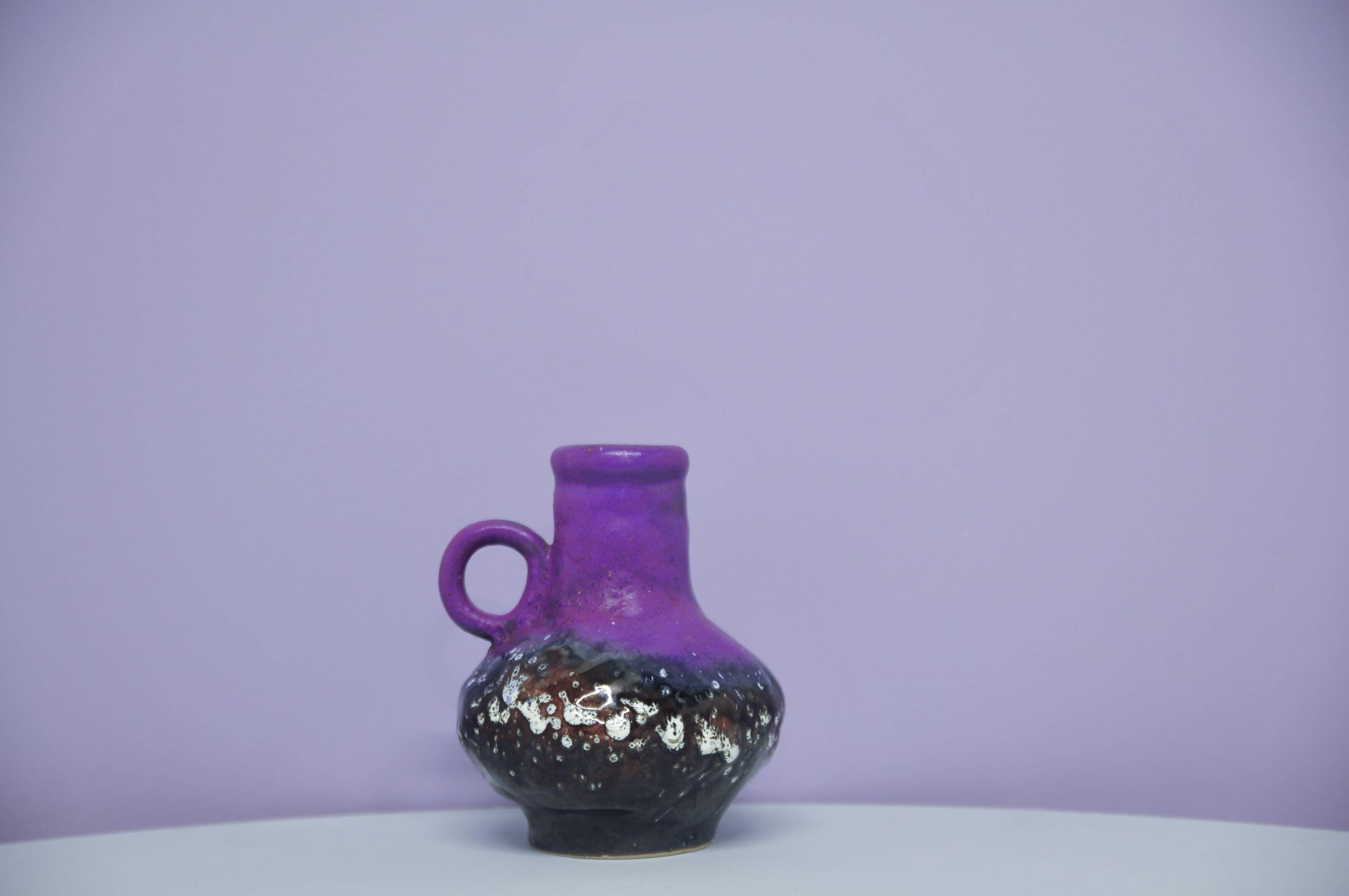 A vintage purple & bronze sheen Fatlava Walter Becht can vase