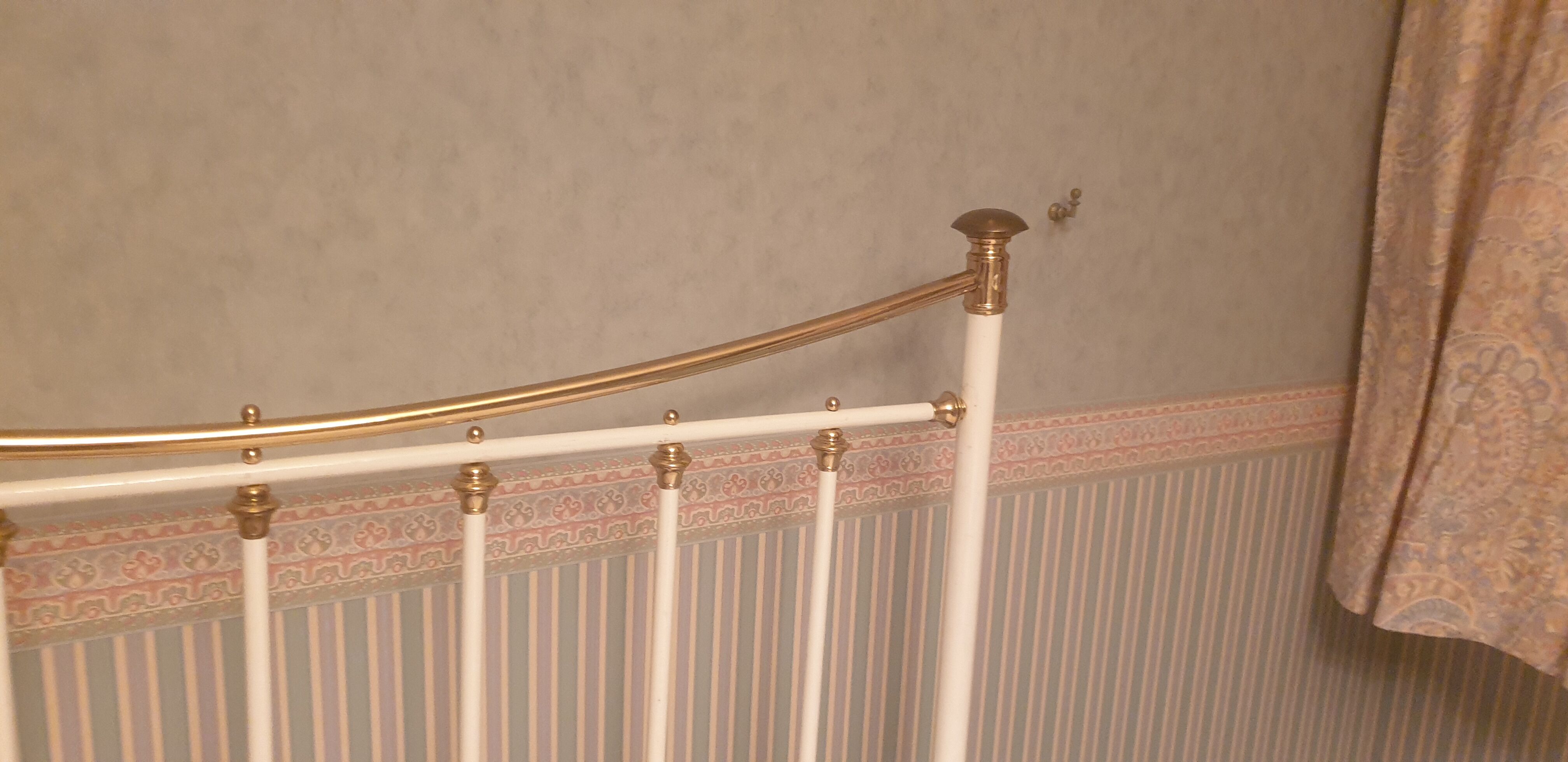 Restored old iron bed