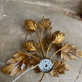Golden wall lamp foliage