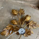 Golden wall lamp foliage