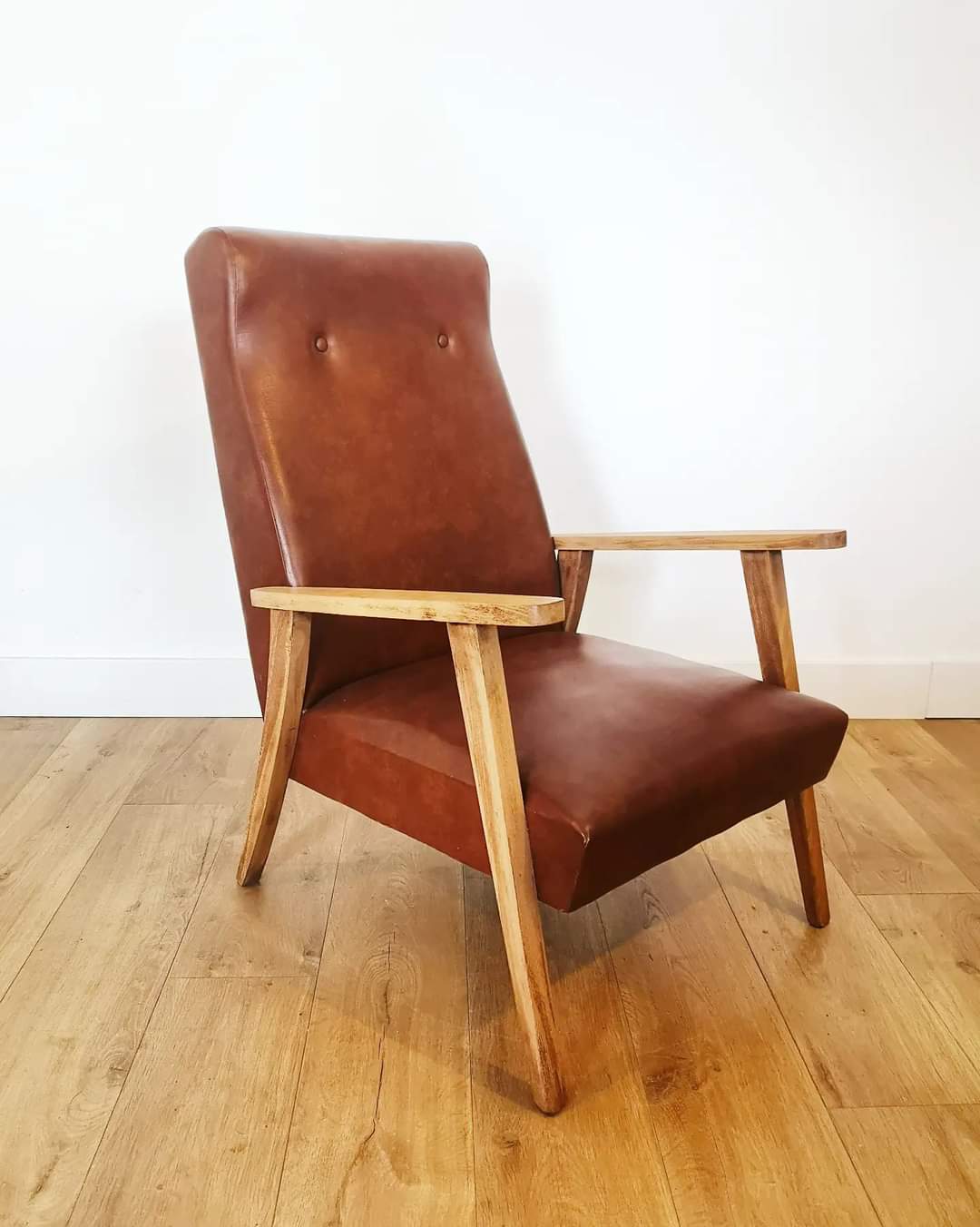 70 armchair in brown skai and wooden structure