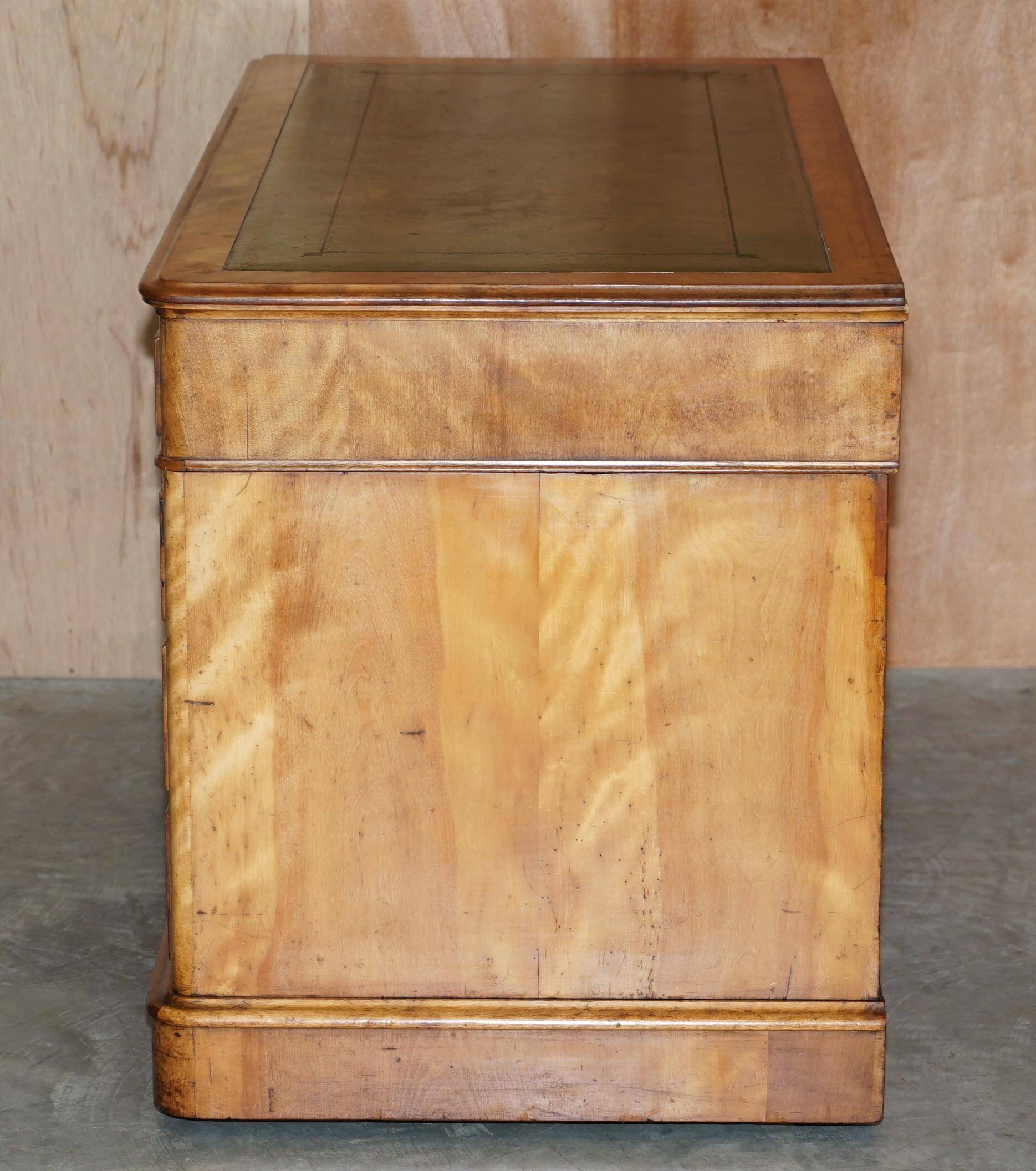 Antique desk by James Winter & Sons London in satin wood and leather.