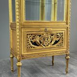 Carved and gilded wooden display cabinet, Louis XVI style, 20th century.