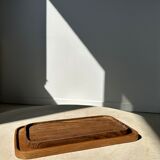 Trio of rounded rectangular trays or cups in monoxyl teak L:35