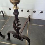 Old pair of wrought iron pegs with brass pine cone