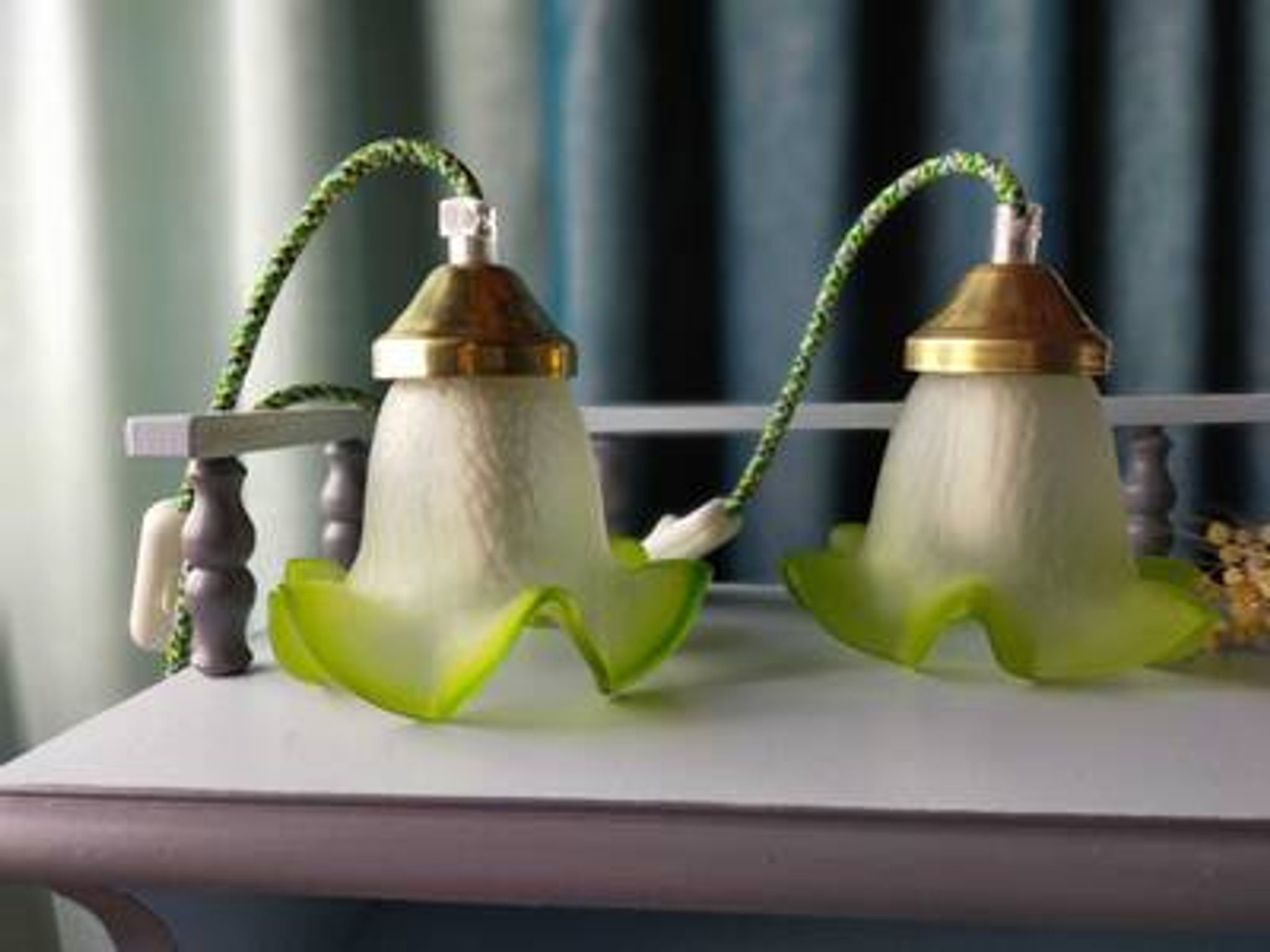 Duo of portable lamps in green tulip design.