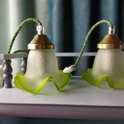Duo of portable lamps in green tulip design.