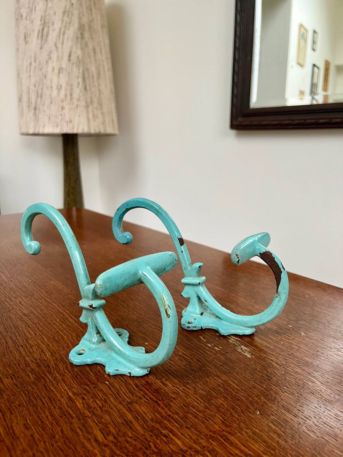 Pair of painted metal wall hooks