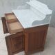 Antique walnut and white marble bathroom cabinet