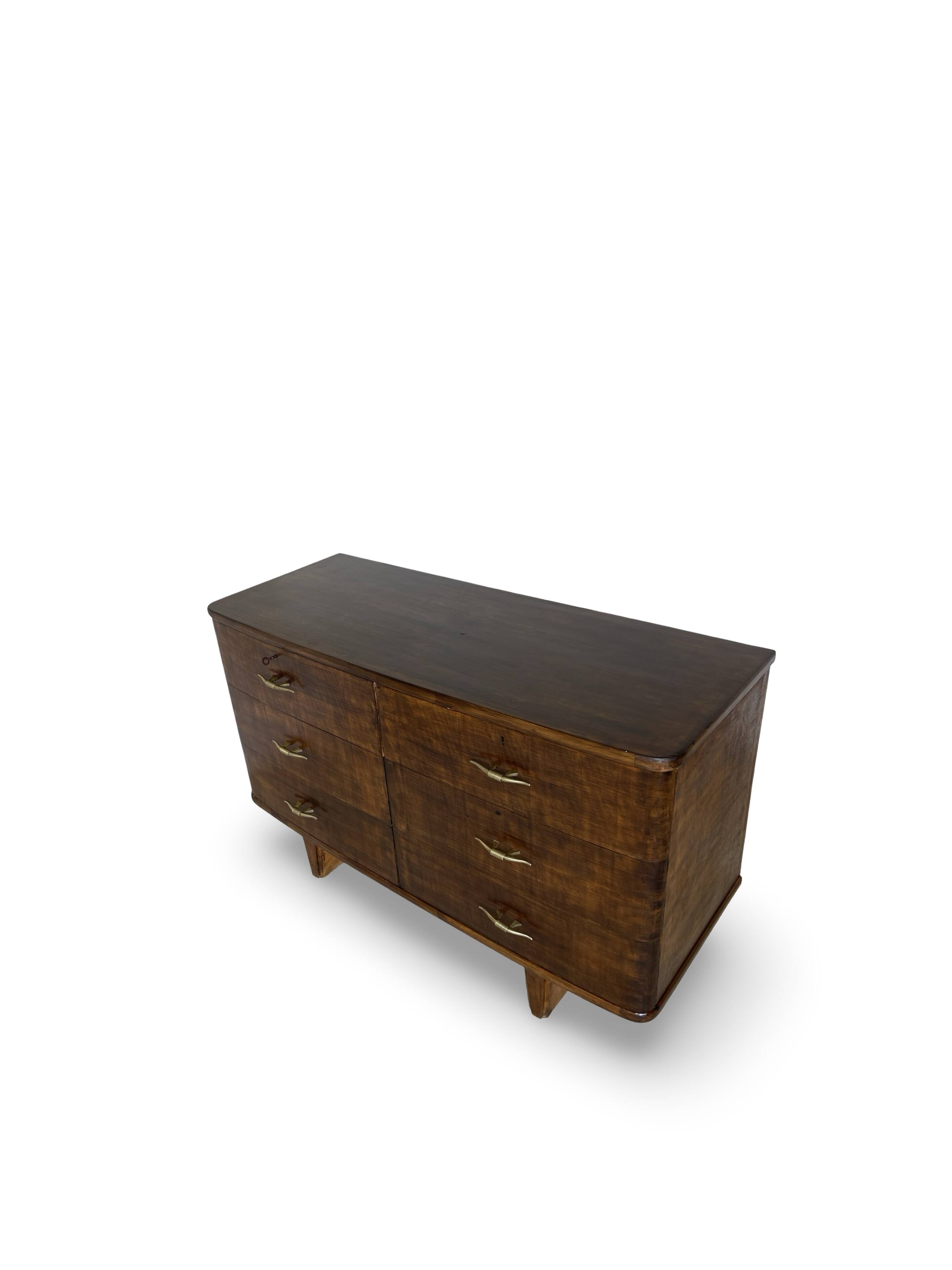 A vintage Italian chest of drawers, made of veneered walnut and solid wood,